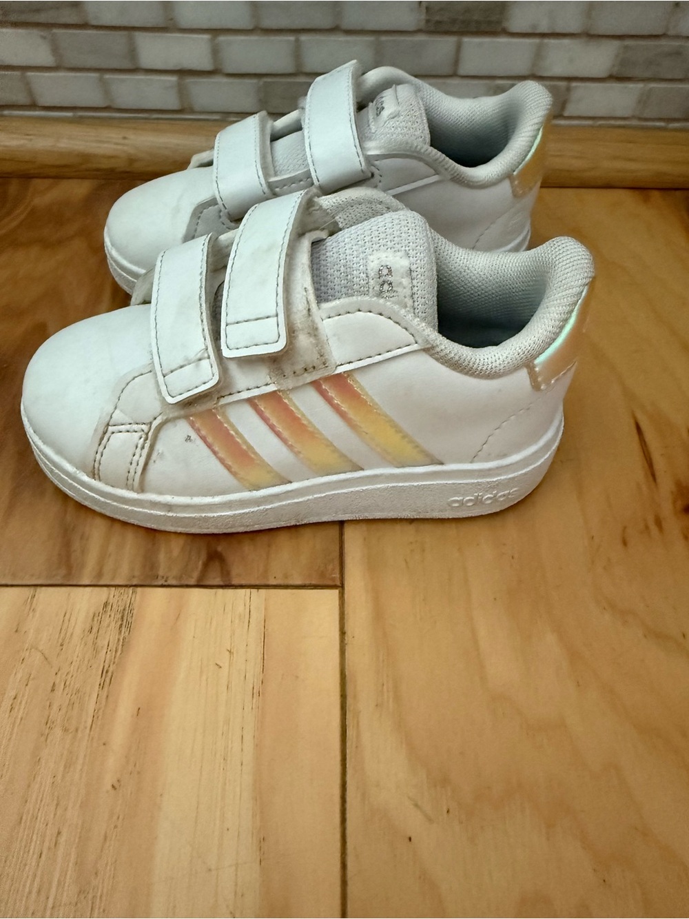 adidas Kids White Sneakers with Iridescent Pink and Yellow Stripes